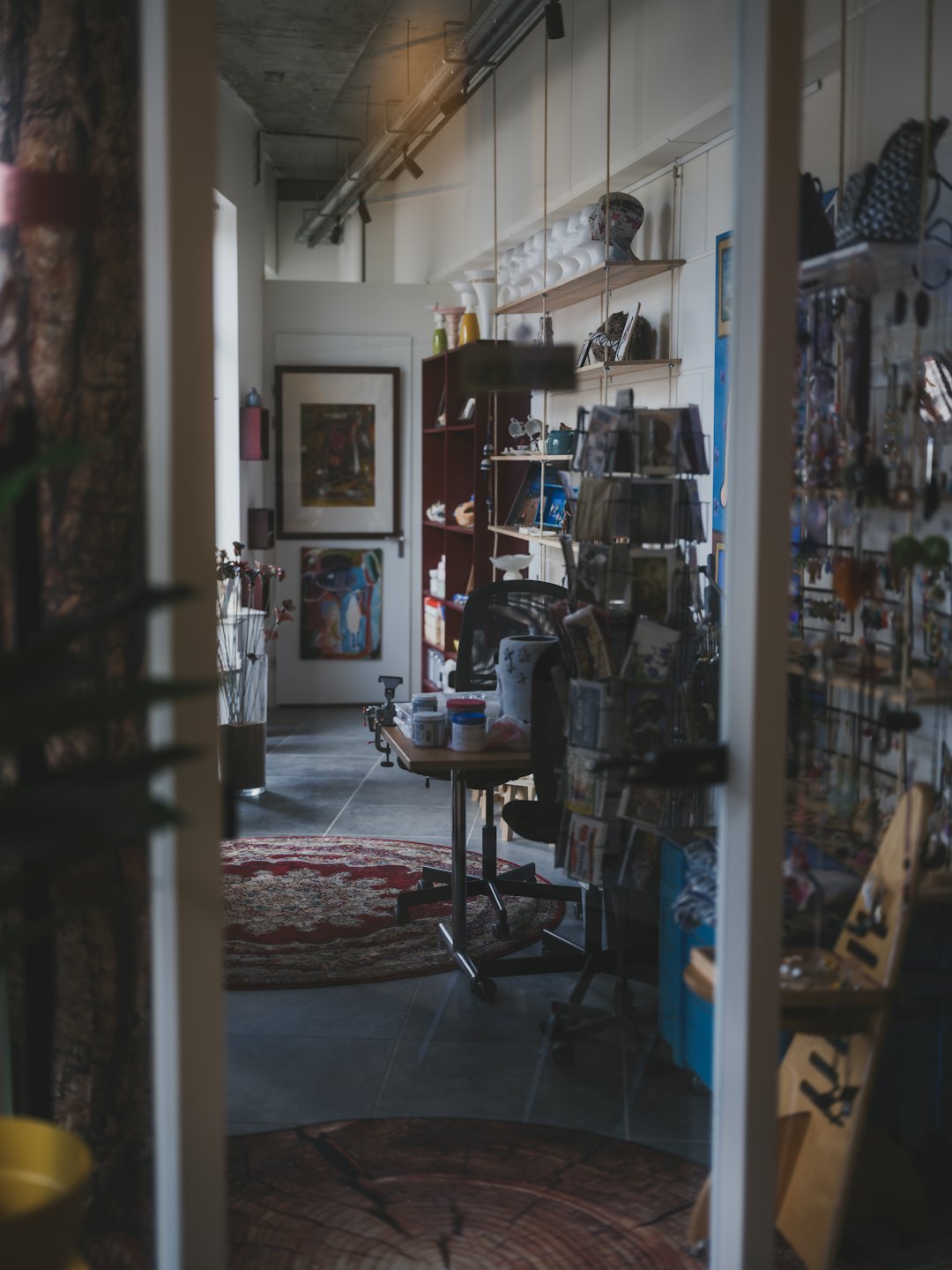 Artisan shop filled with handmade pottery, art, and cards.